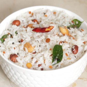 The South Indian Coconut Rice made with cooked rice, grated coconut and tempering.
