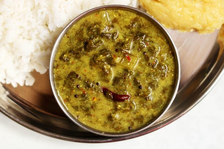 Ava Pettina Thotakura Pulusu A Bowl of Ava Pettina Thotakura Pulusu with Rice and Dal