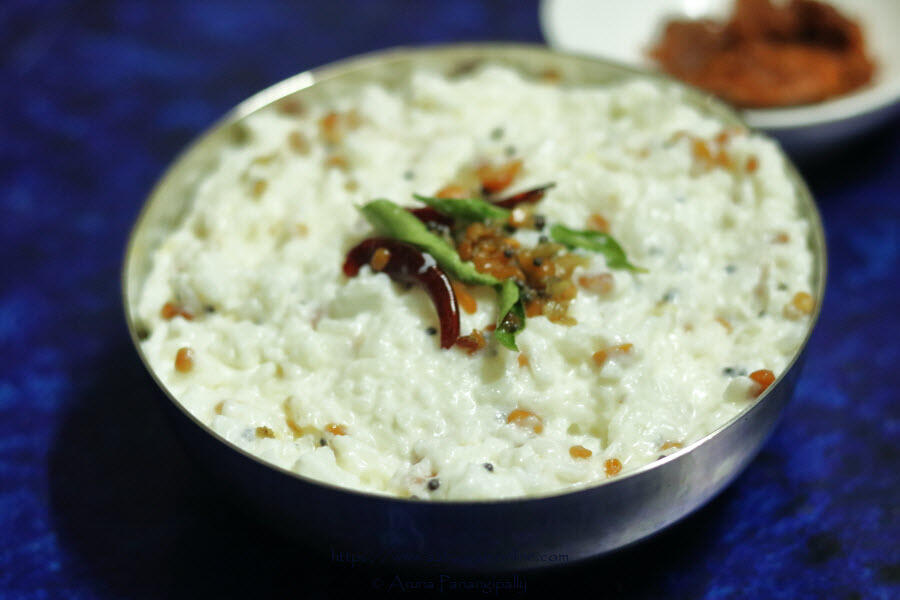 Curd Rice served with pickle. Tempered Curd Rice is called Daddojanam in Andhra/Telangana and Thayir Sadam in Tamil Nadu.