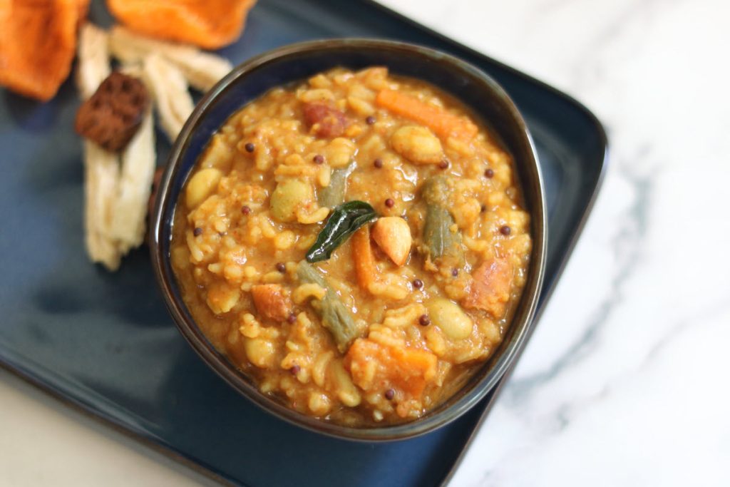 Bisi Bele Huli Anna, a traditional rice dish with tuvar dal, vegetables and warm spice mix.