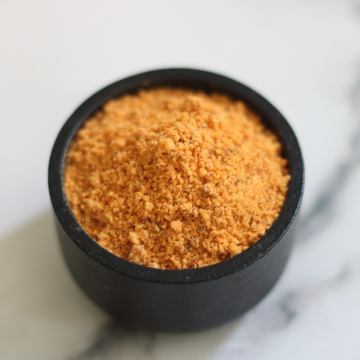 Idli Podi, also known as Karam Podi or Milagai Podi, is made roasted and coarse ground lentils, sesame, and red chillies.