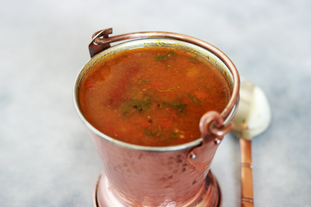 The tangy, delicious and soupy Tomato Rasam. Also called Tomato Charu, Tomato Saaru or Thakkali Rasam.