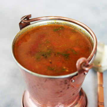 The tangy, delicious and soupy Tomato Rasam. Also called Tomato Charu, Tomato Saaru or Thakkali Rasam.