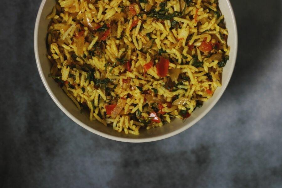 A close-up of Methi Tomato Rice | Methi Tamatar Pulao