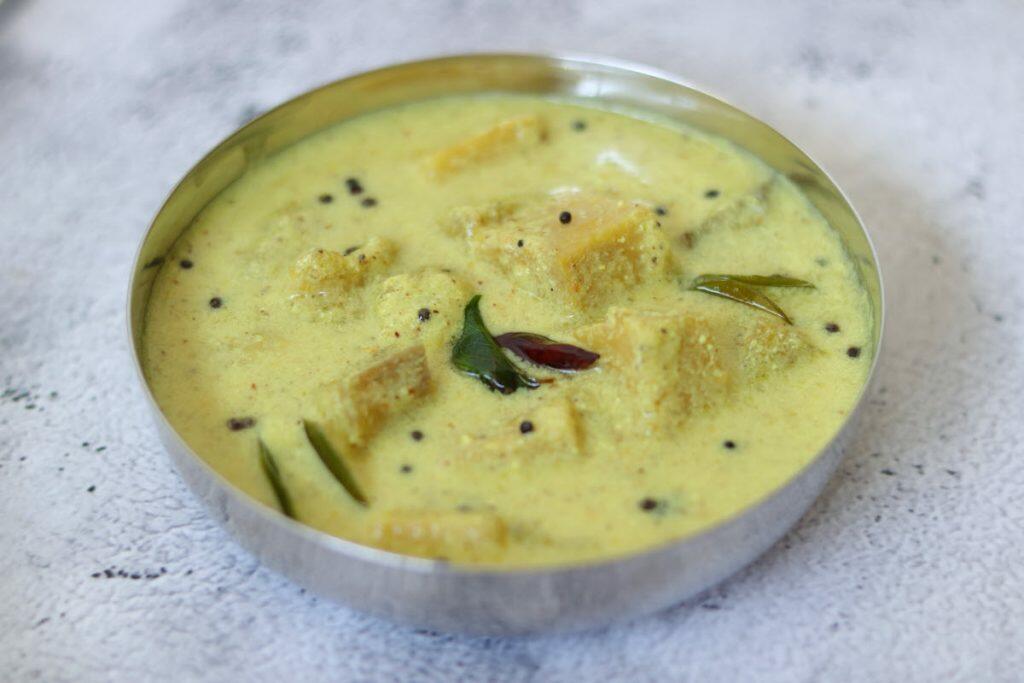 Kalan, a traditional Kerala dish of Banana & Yam in a coconut and yogurt gravy flavoured with pepper and fenugreek. 