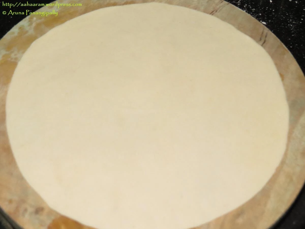 Roll the dough into a roti