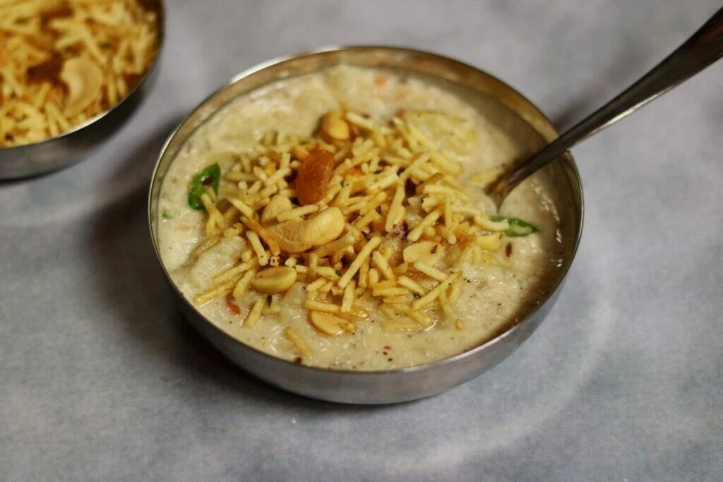 A bowl of Farali Misal or tempered boiled potato in a coconut-peanut gravy. This dish is eaten on days of fasting and is called Upvas ka Khana