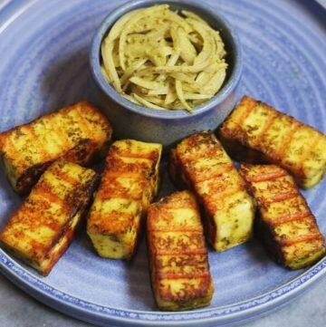 Hariyali Paneer Tikka is a tangy pan-grilled Indian Cottage Cheese starter flavoured with mint, coriander, lemon juice and more