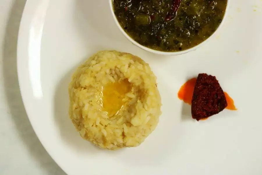 A portion of Mudda Pappu Annam, plain dal and rice, with Avakai and some Thotakura Pulusu
