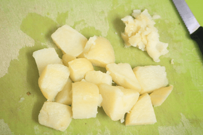 Pieces of boiled potato with a few pieces mashed well