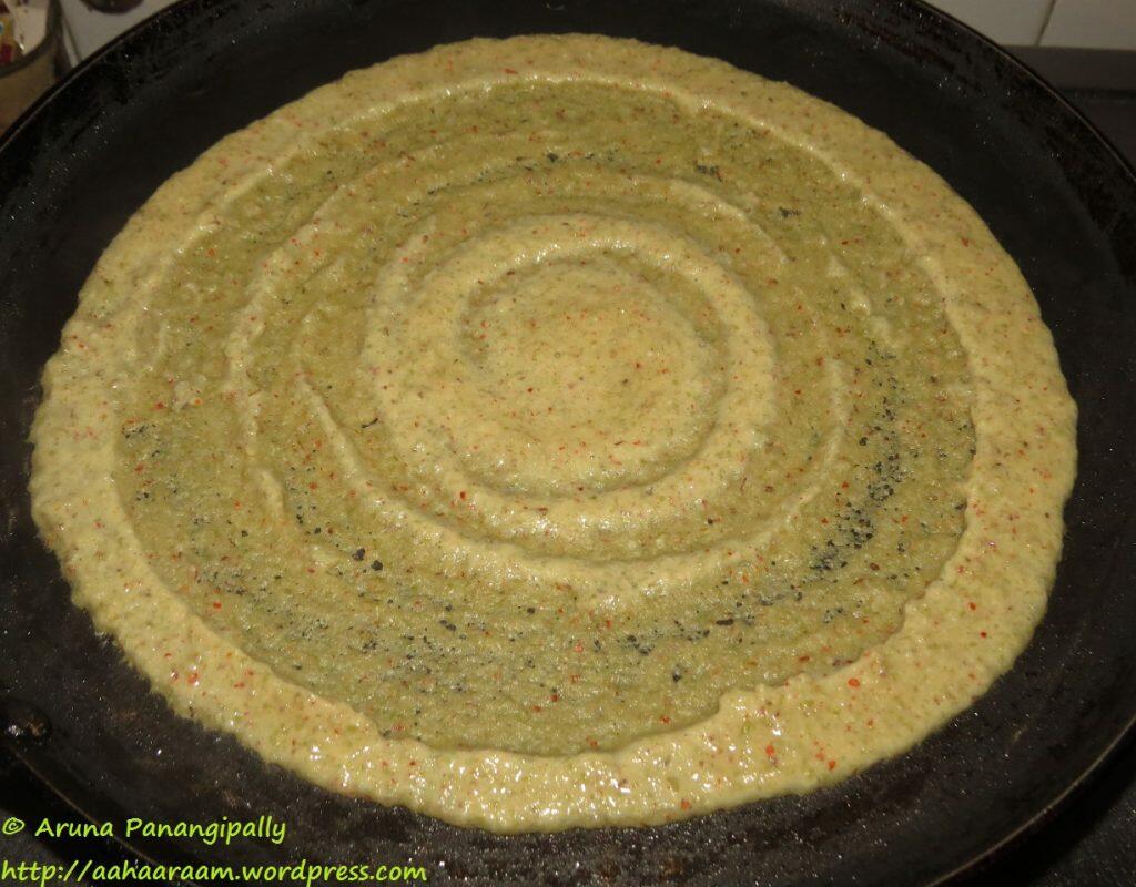 Pesarattu - Spread evenly to form a thickish dosa