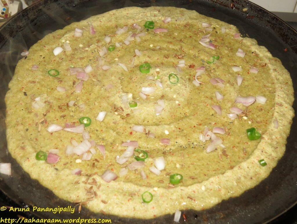 Pesarattu - Sprinkle some finely chopped onion, chillies and jeera