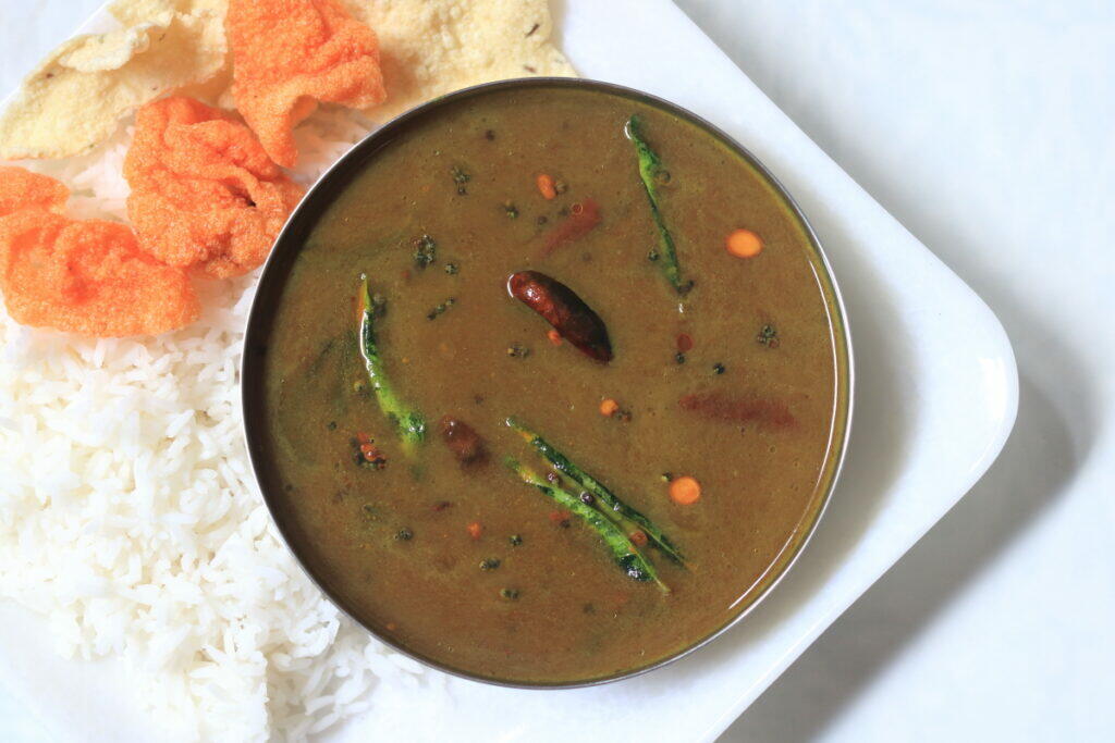 Called Pulihora Pulusu in Andhra and Puli Venda Saar in Tamil Nadu, this tangy, spicy tamarind gravy is eaten with rice..