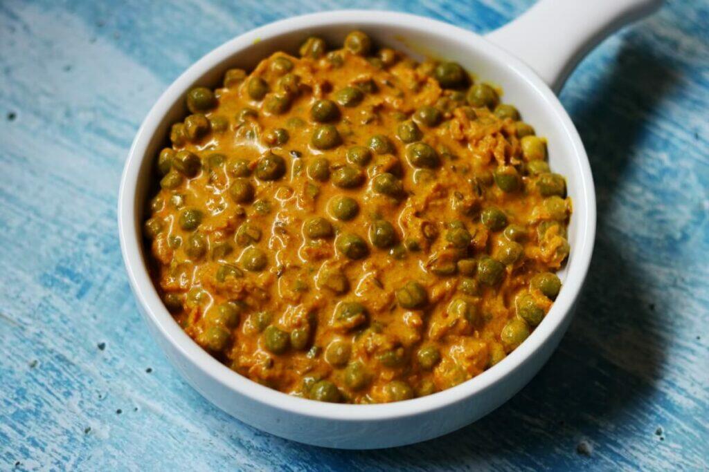 Gluten-free, vegetarian Haldi ki Sabzi made with grated turmeric root and fresh peas from Rajasthan.