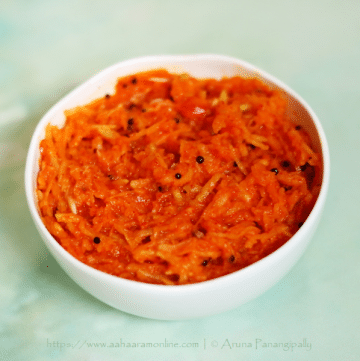Kanda Kairi is made by mixing grated raw mango and grated onion with chilli powder and jaggery