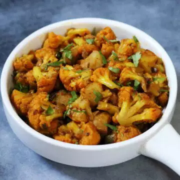 A bowl of Aloo Gobi, the Cauliflower and Potato Stir-fry that is the ultimate comfort food in Punjab