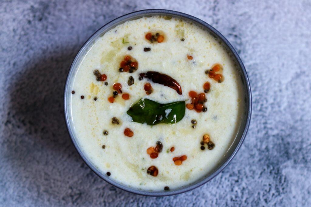 Super easy to make, delicious and tangy Amla Raita called Usirikaya Perugu Pachadi in Andhra and Nellikai Thayir Pachadi in Tamil Nadu