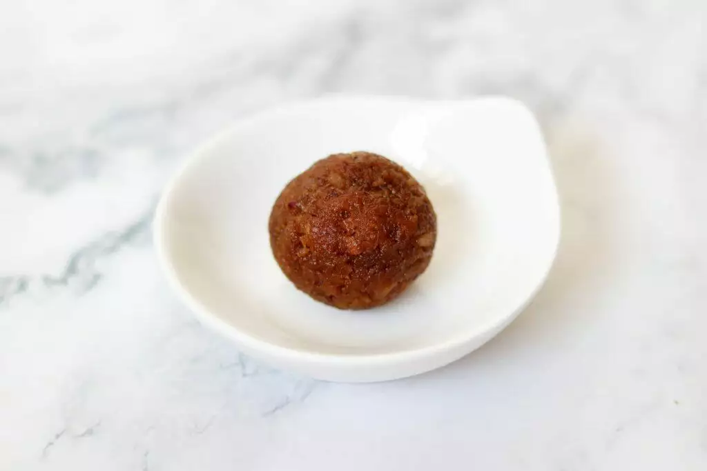 Coconut Laddu made with Jaggery. Known as Narkel Naru in Bengal and Kobbari Louz in Andhra & Telangana. 