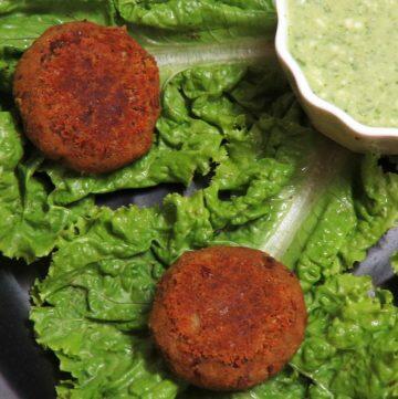 Vegetarian Galouti Kebab with Rajma and Soya served ona bed of lettuce and mint chutney on the side