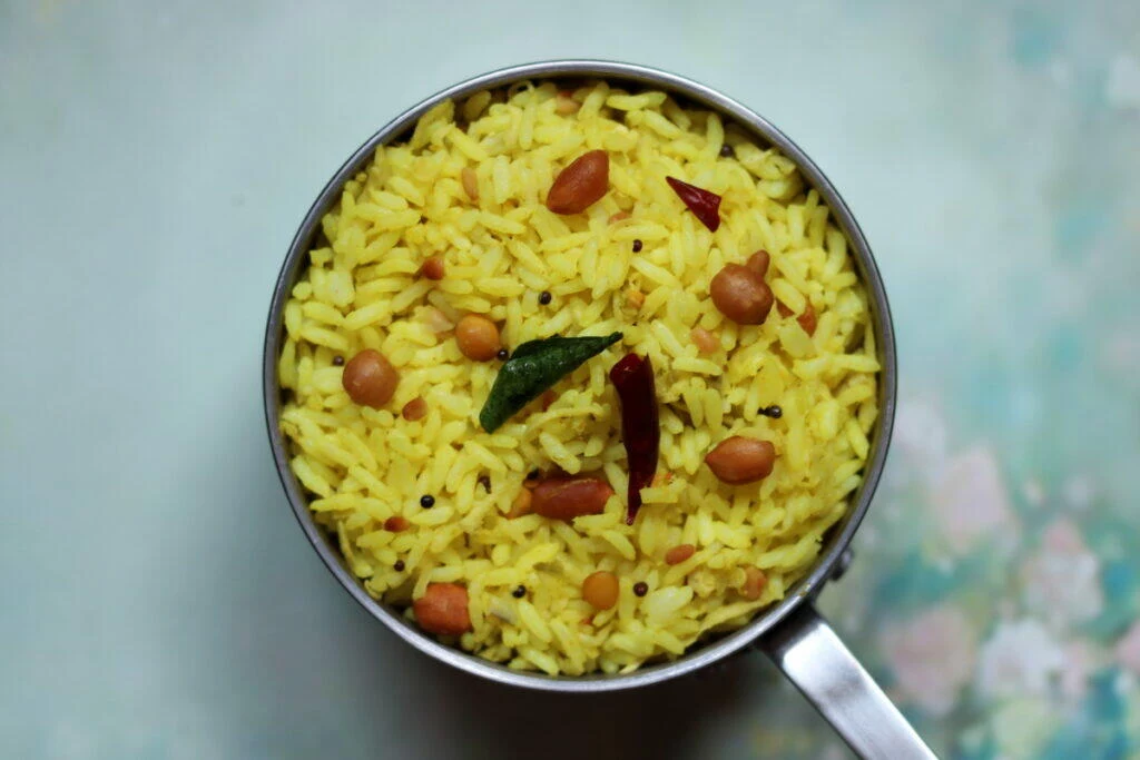 Mango Rice, Mamidikaya Pulihora, Mangai Sadam or Mavinakai Chitranna is a tangy rice made with grated unripe or raw mangoes.