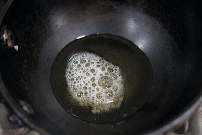 Mustard seeds crackling in hot oil.