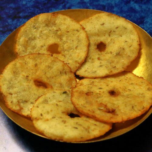 Andhra Kobbari Garelu served on a brass plate