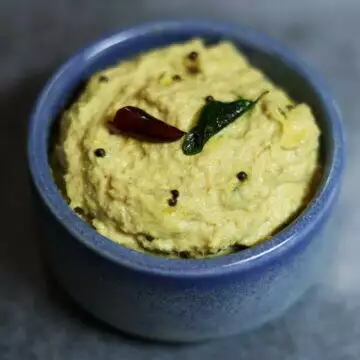Mamidikaya Nuvvula Pachadi, a raw mango and sesame seeds chutney from Andhra, is tangy, nutty vegan, and gluten-free