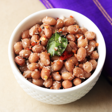 Peanut Sundal—also called Verkadalai Sundal, Palli Guggillu or Verusenaga Guggillu—is a snack made with boiled peanuts flavoured with grated fresh coconut and a traditional South Indian tempering.