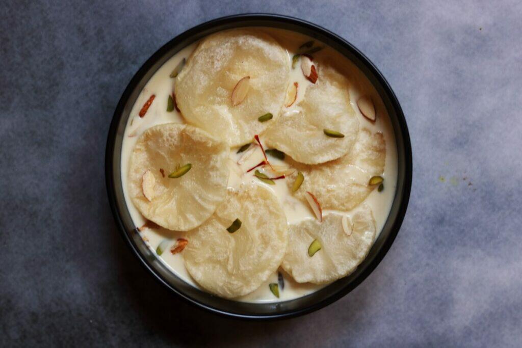 Halu Holige or Dudh Puri, a simple dessert of puris soaked in flavoured milk.