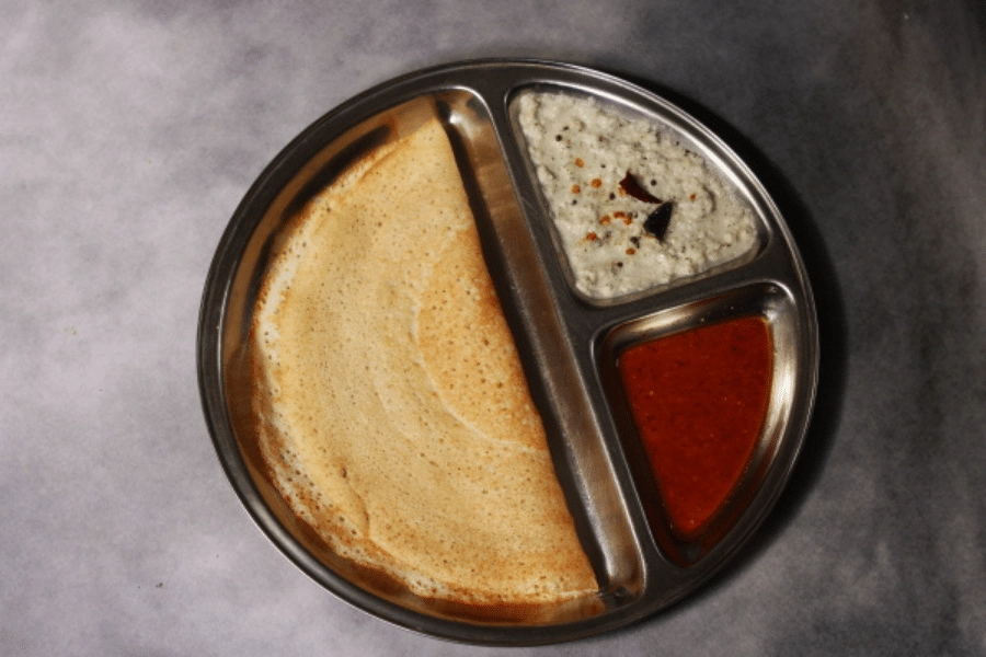 Thin and crisp no dal dosa made with rice and poha