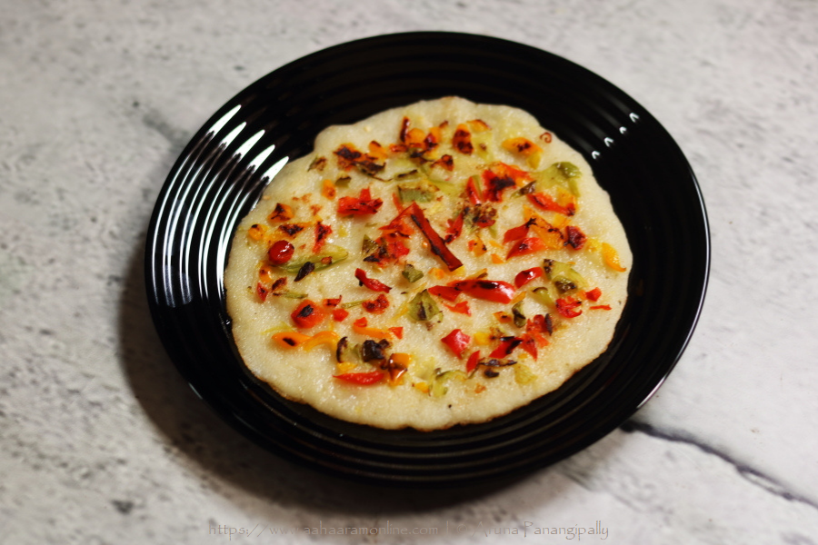 Rava Uttapam topped with bell peppers makes for a filling snack or breakfast