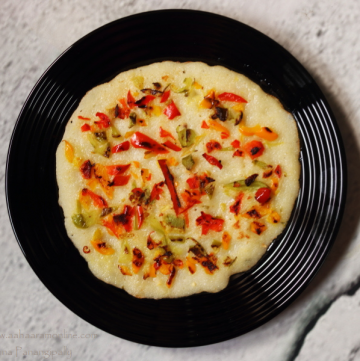 Rava Uttapam or Semolina Pancake topped with bell peppers is a filling snack or breakfast