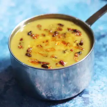 A simple Sindhi Moong dal tempered with ghee-fried crushed garlic and dried pomegranate seeds (anardana)