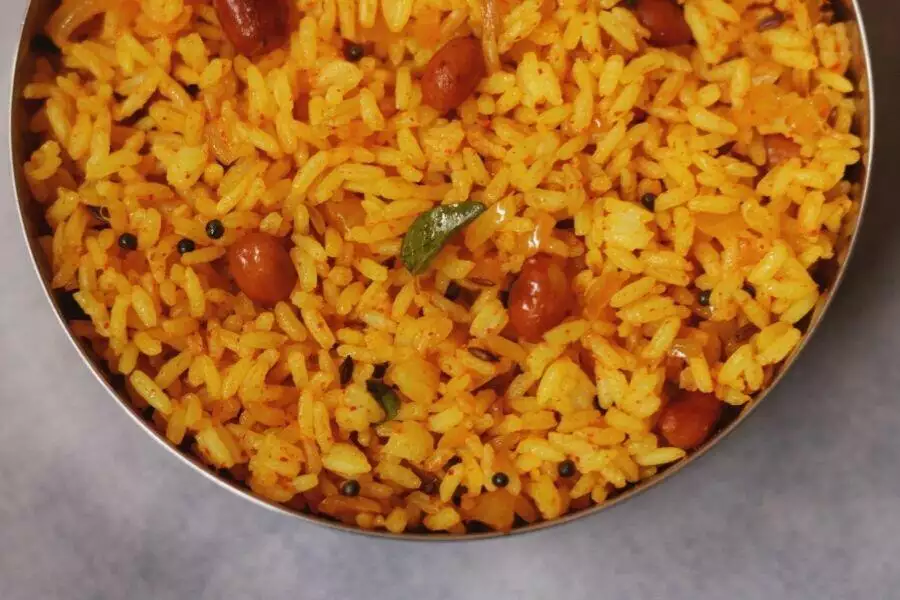 A close up of Phodnicha Bhaat, the seasoned fried rice from Maharashtra