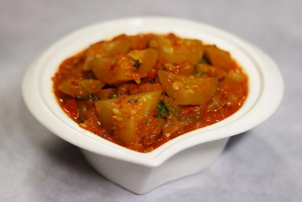 A bowl of Punjabi Tinda Masala or Tinde ki Sabzi that is very popular in North India and is served with rotis