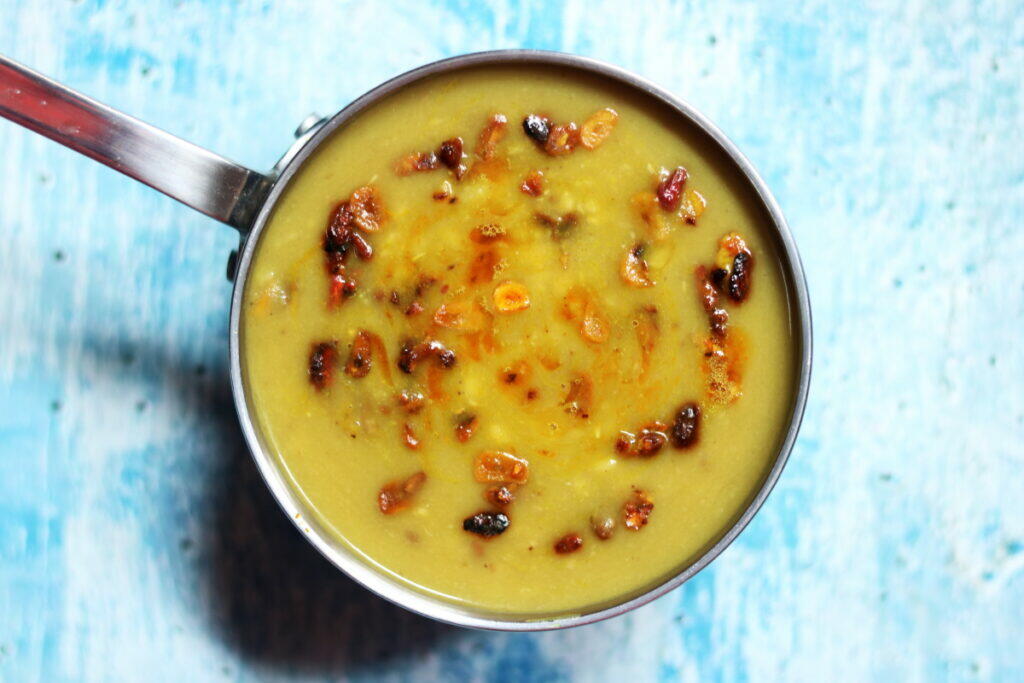 Simple boiled Moong Dal with a tempering of crushed lasoon (garlic) and anardana (dried pomegranate seeds)