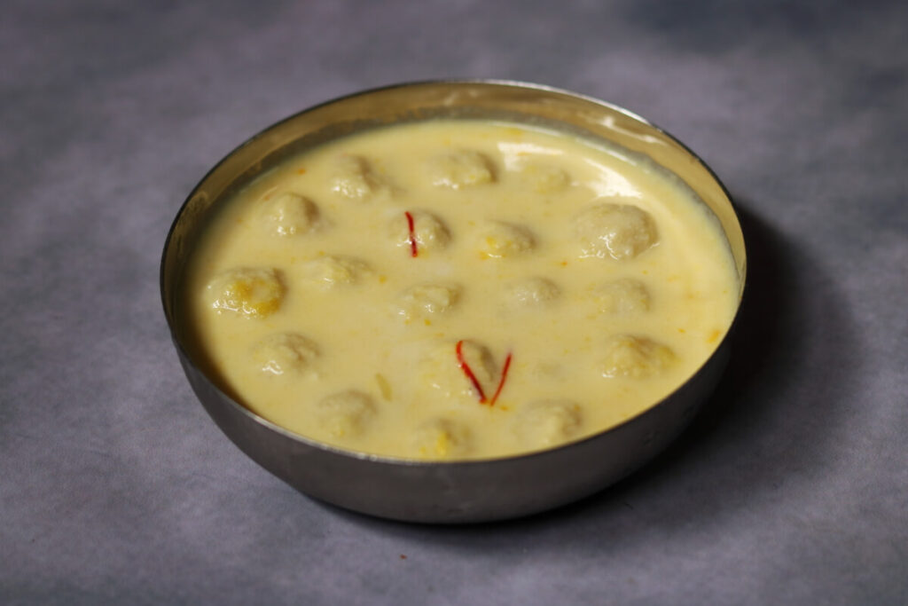 Sudha Sindhu, a Bengali Dessert of Almond and Mava Balls in Saffron-flavoured Milk