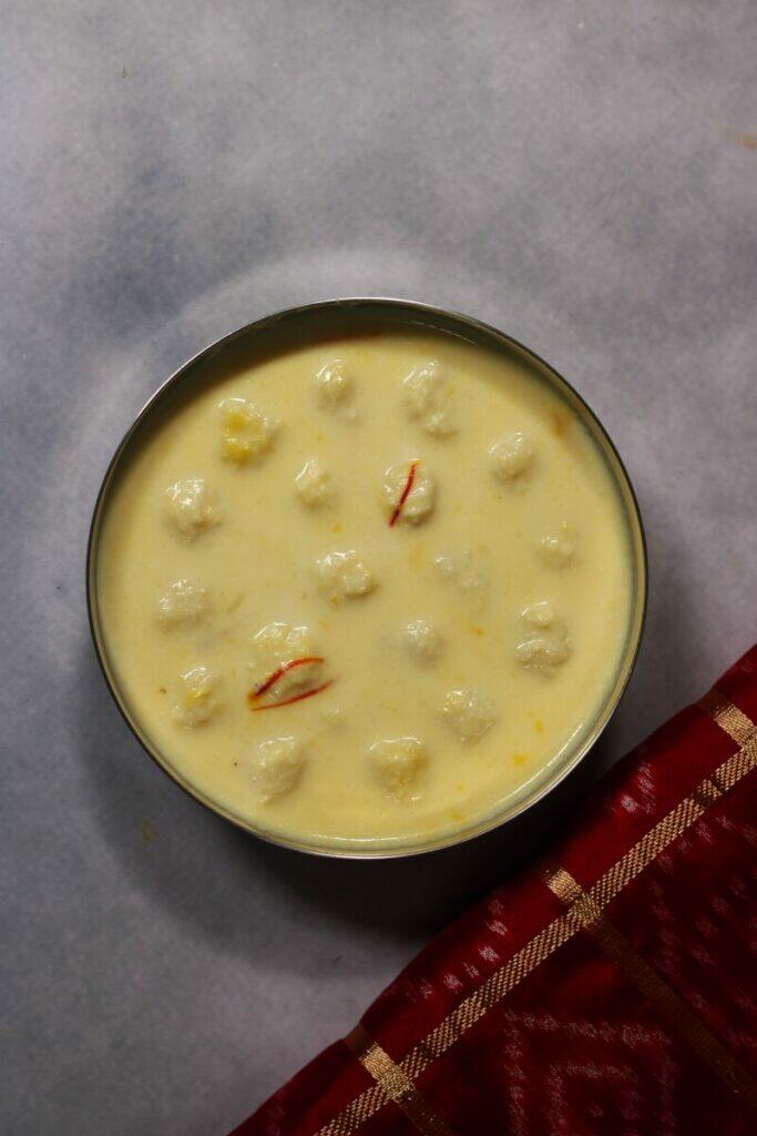 A Bowl of Sudha Sindhu, a Bengali Sweet of Almond + Mava Balls in Saffron Milk
