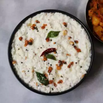 A bowl of Ava Pettina Daddojanam, a classic Andhra dish of Curd Rice flavoured with mustard