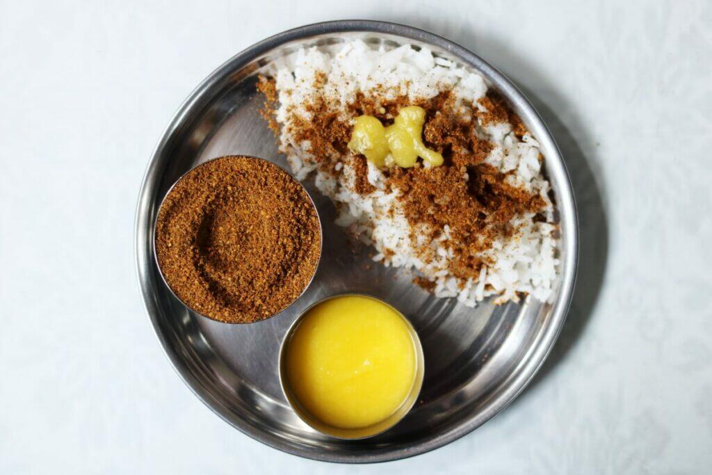Vepam Poo Podi or Neem Flowers Chutney Powder served with rice and ghee
