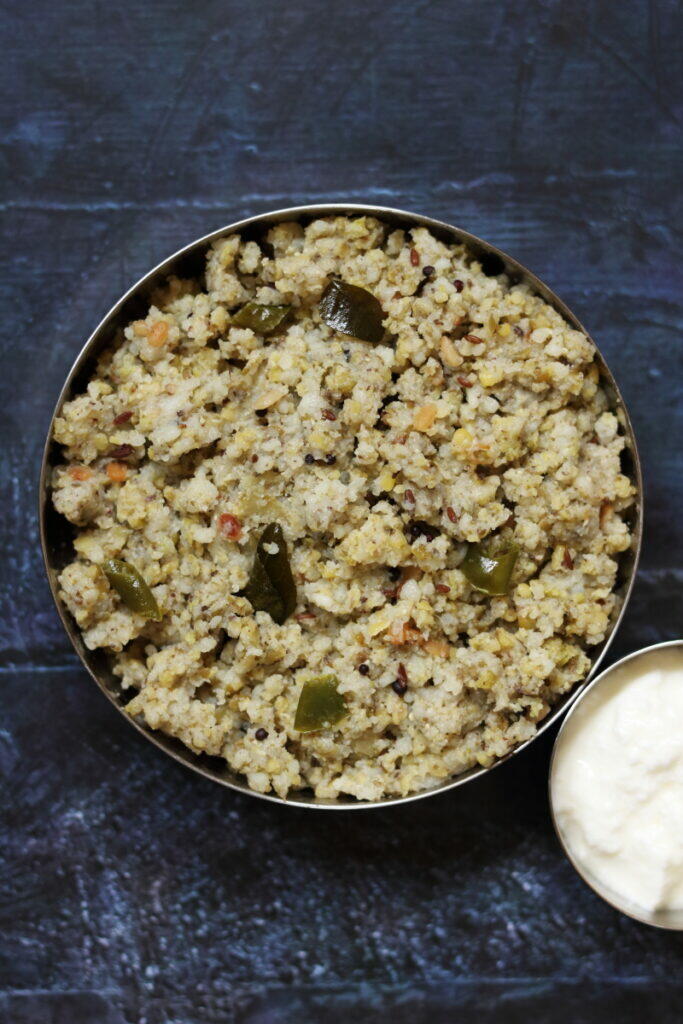 A bowl of Pesalu Biyyam Rava Upma, a hearty breakfast made with coarsely ground whole moong and rice.