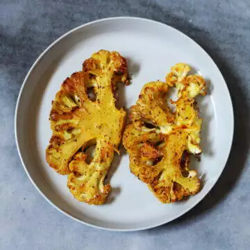 Roasted Cauliflower Steaks are delicious, filling, vegan, gluten-free, and low-calorie to boot.