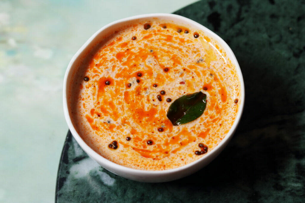 Avakai Perugu Pachadi made by mixing the masala part of the Andhra Mango Pickle in yogurt.