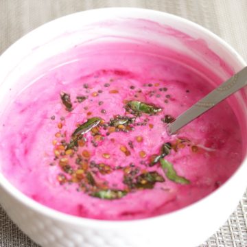 Beetroot Raita or grated beetroot in cumin-spiced yogurt. Vegetarian, gluten-free dish.