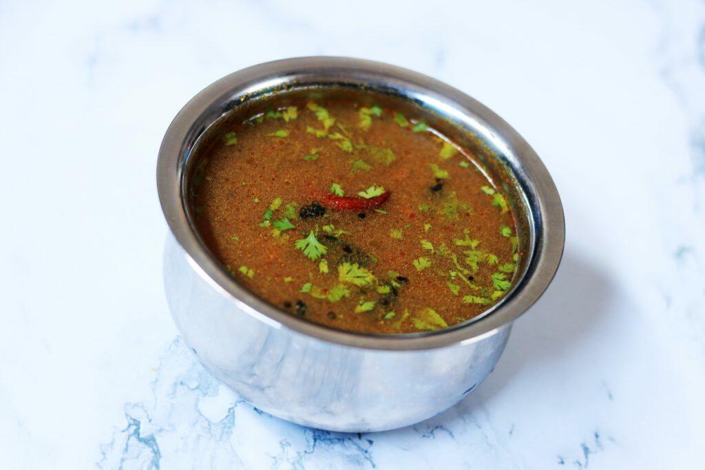 Vamu Charu or Omam Rasam is a traditional vegan, gluten-free dish that helps with digestion and soothe the stomach in case of food poisoning.