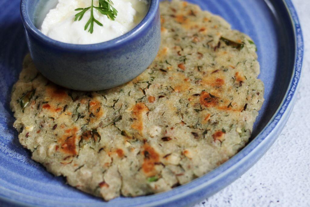 Bhagar Thalipeeth or Sama Paratha made with little millet flour, roasted peanuts, green chillies, and coriander.