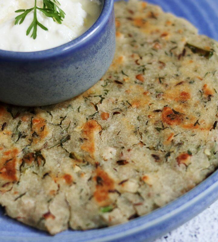 Bhagar Thalipeeth or Sama Paratha made with little millet flour, roasted peanuts, green chillies, and coriander.
