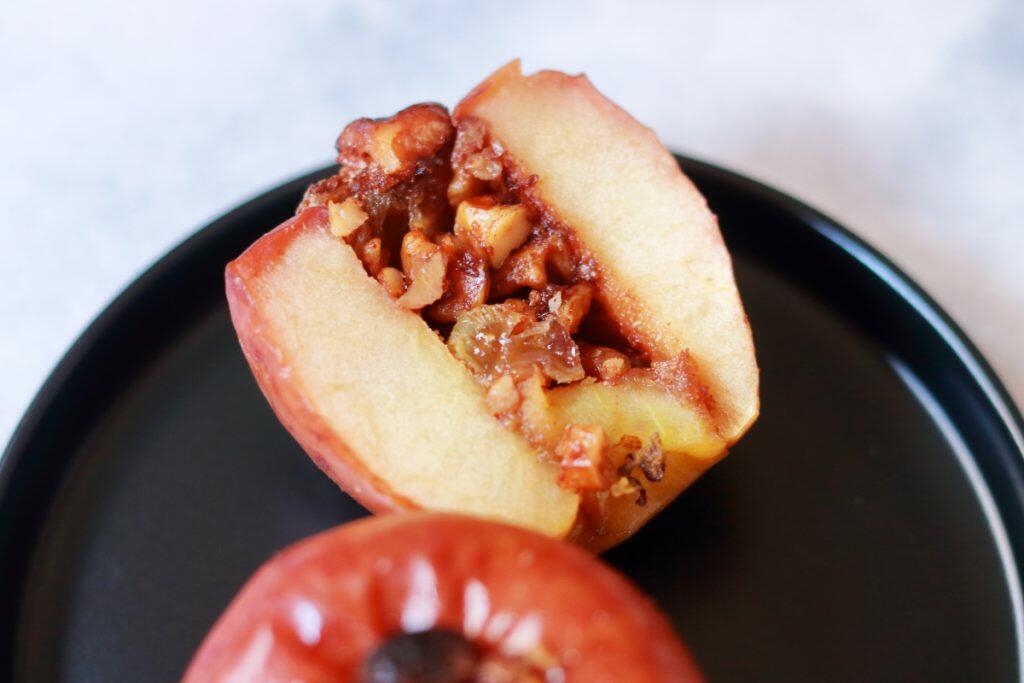 Easy to make, delicious and festive Baked Apple stuffed with walnuts, raisins, brown sugar and cinnamon.