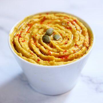 Pumpkin Hummus that uses roasted pumpkin puree to enliven the already delicious hummus.