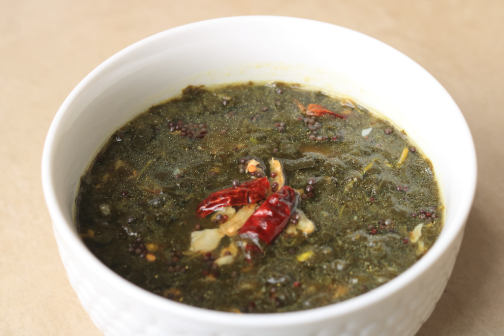 The traditional Andhra Gongura Pulusu or Red Sorrel Stew. Easy to make, tangy, and delicious.